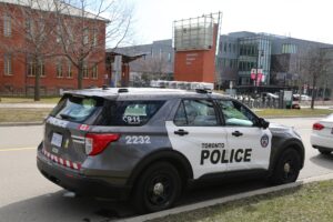 A Toronto Police Car is parked outside Humber College Lakeshore Campus.